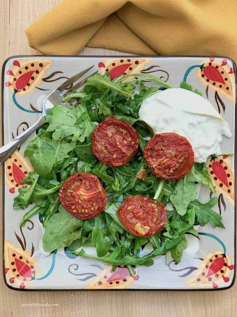 Roasted Tomato and Arugula Salad with a serving of burrata.