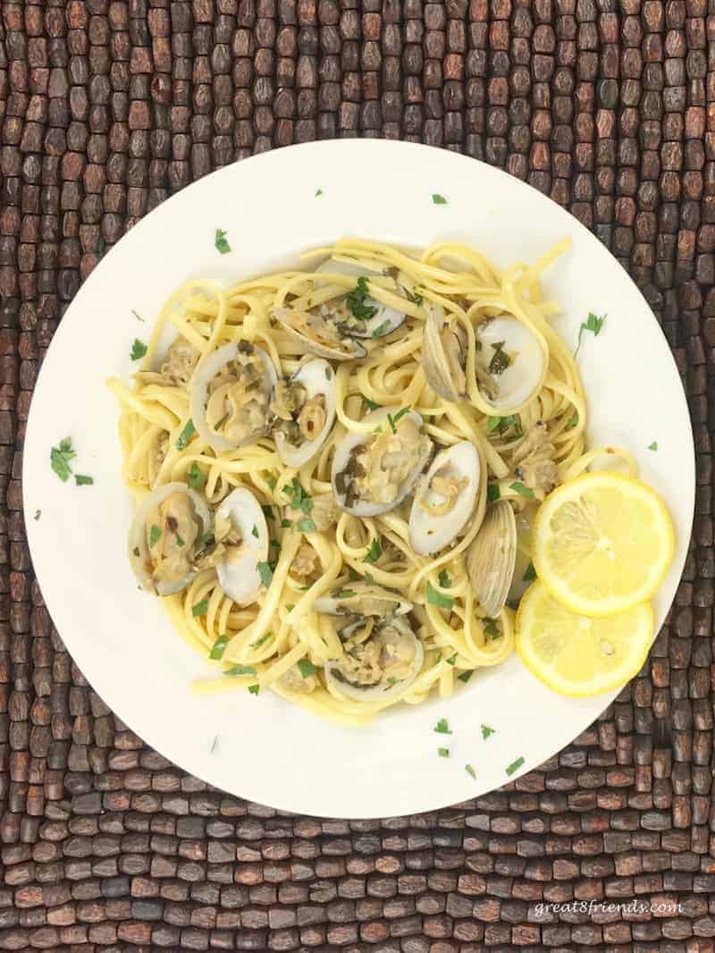 Overhead shot of Linguine with Clams in a round white bowl with a wide brim.