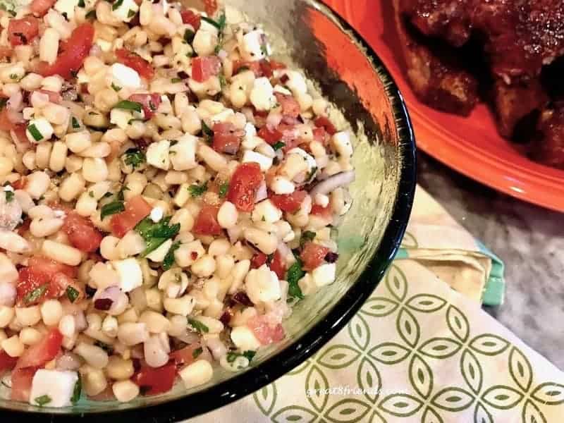 Corn Salad in a green glass bowl.