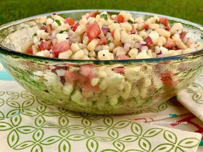 Corn Salad in a green glass bowl.