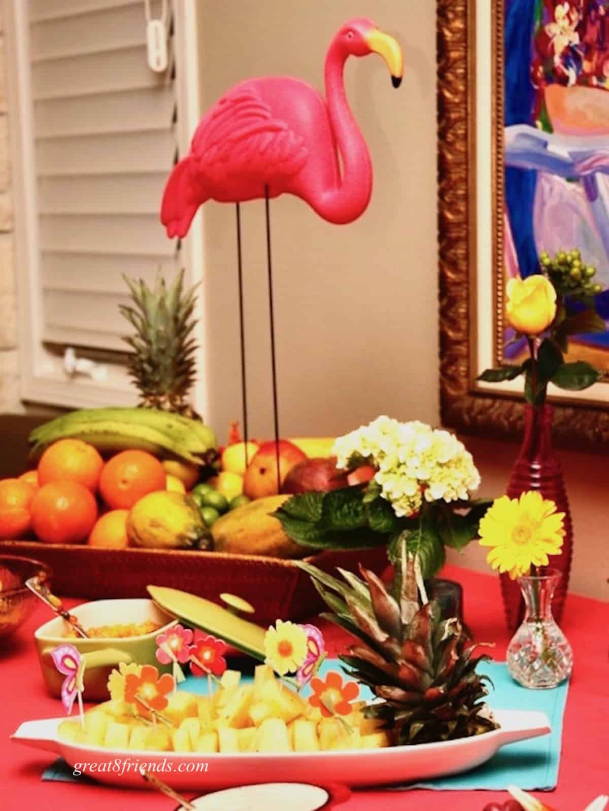 Appetizer table with pink flamingo centerpiece.