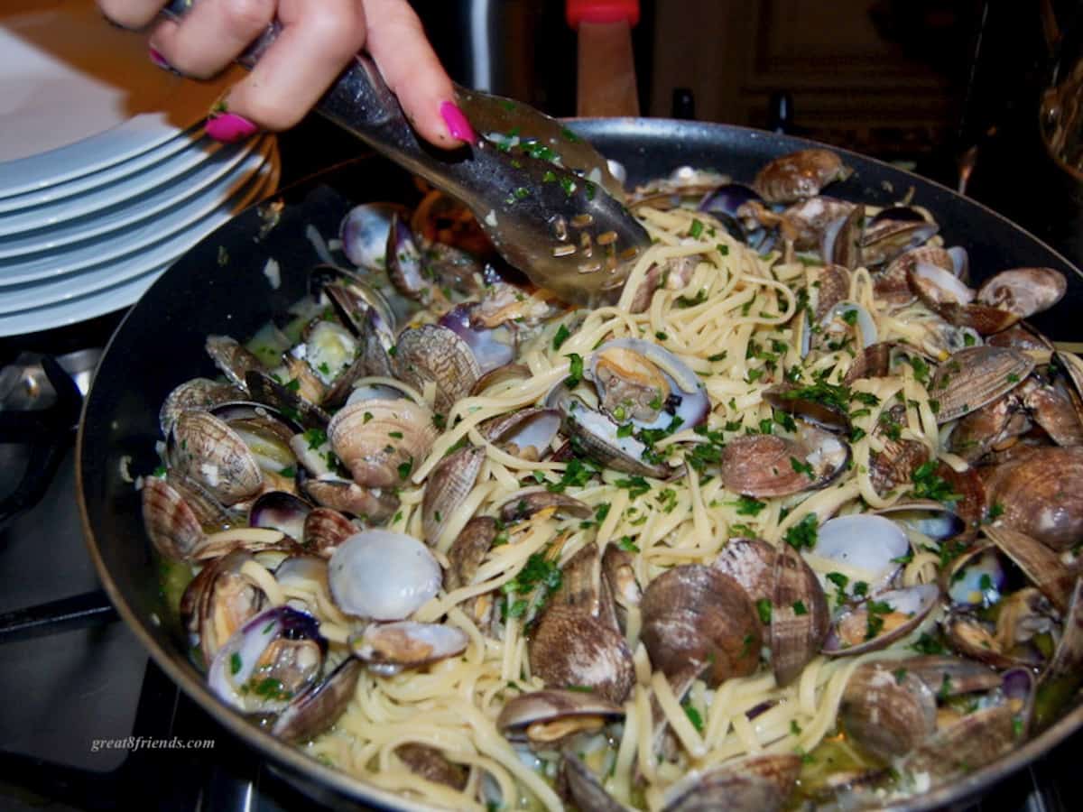 Linguine and clams in frying pan.