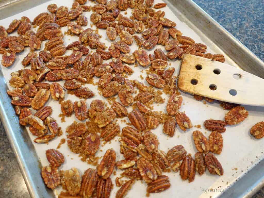 Sugar and Spice Pecans on baking sheet. 