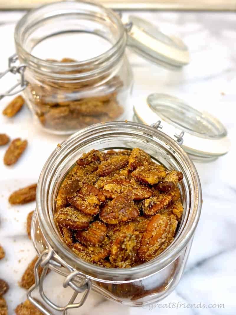 Sugar and Spice Pecans, overhead shot in glass jars. Nuts.