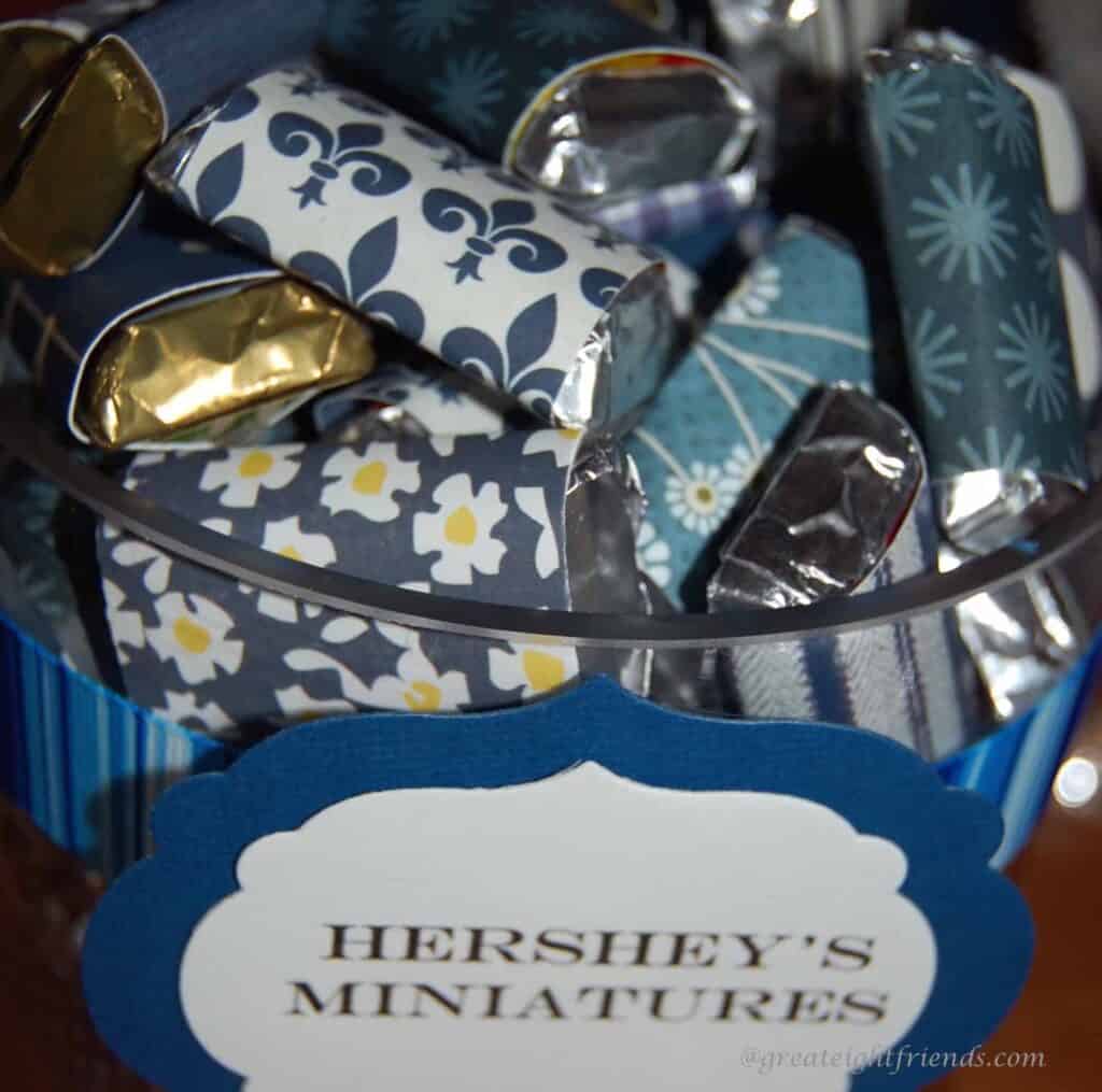 Hershey's minis wrapped in blue coordinating papers.