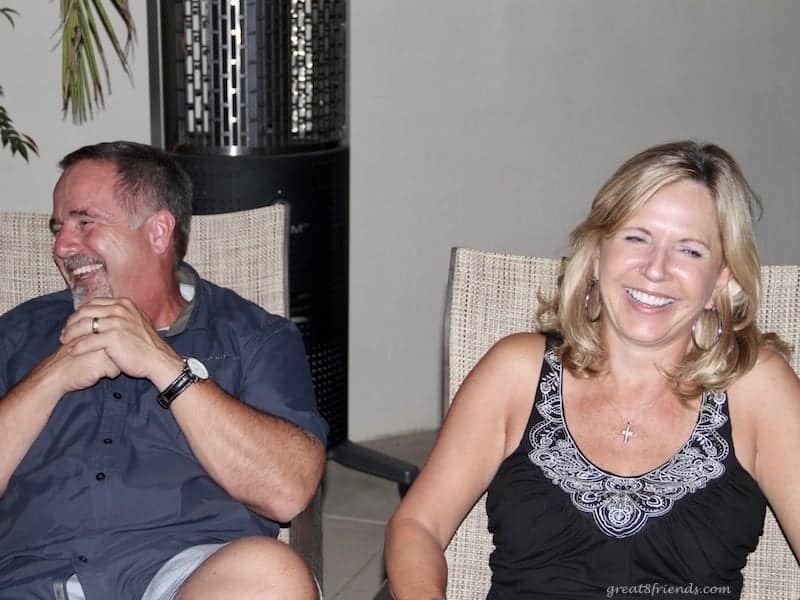 A man and a woman laughing.