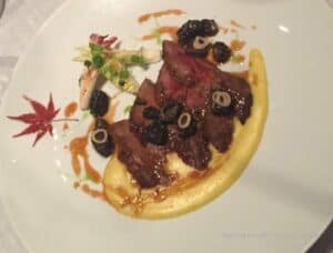 Caramelized Plume of Iberico Pork with Creamy Polenta and Belgian Endive