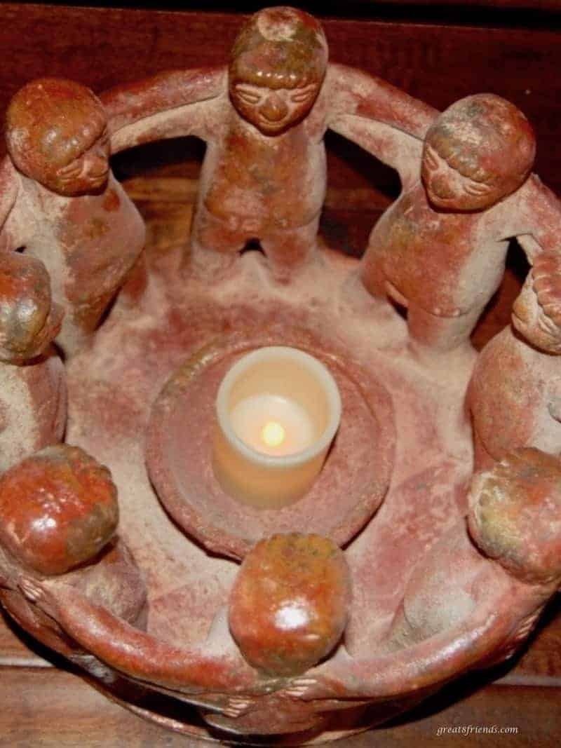 Clay 'Circle of Friends' with a small battery operated candle in the middle.