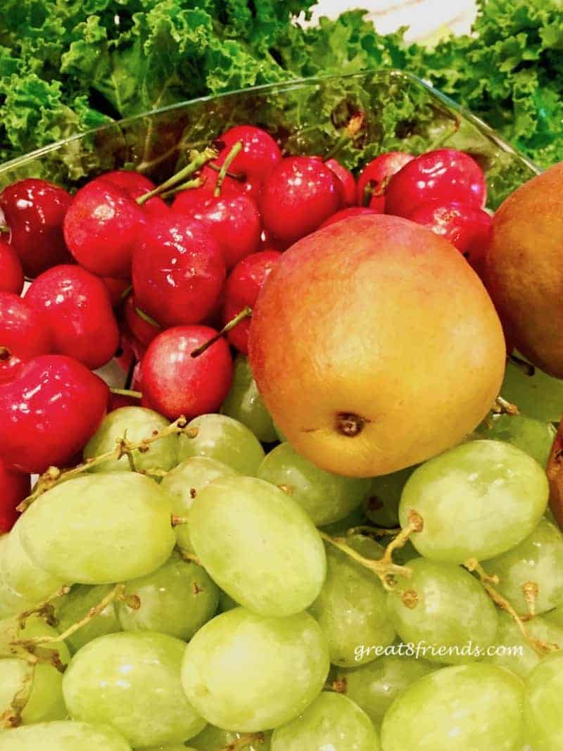 Close up of fruit, cherries, pear, and grapes.