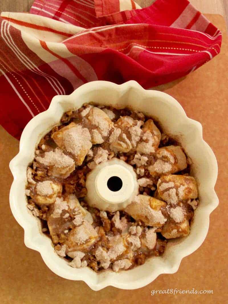 Unbaked sticky buns (monkey bread) ready for rising in a bundt pan.