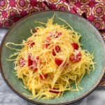 Bowl of spaghetti squash and tomatoes.