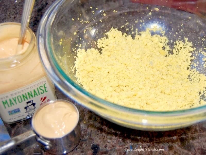 Eggs all chopped up in a glass bowl ready to add the mayo.