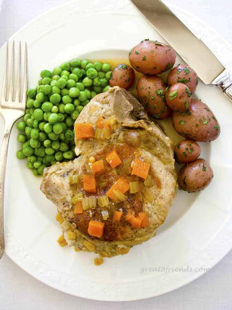 These Stuffed Pork Chops are the perfect company meal. They cook for an hour and a half, so you can enjoy your guests while this delicious meal cooks!