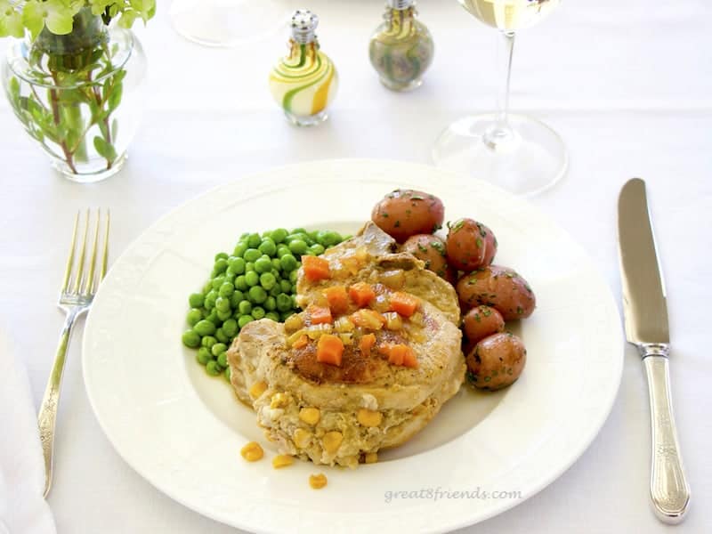 These Stuffed Pork Chops are the perfect company meal. They cook for an hour and a half, so you can enjoy your guests while this delicious meal cooks!