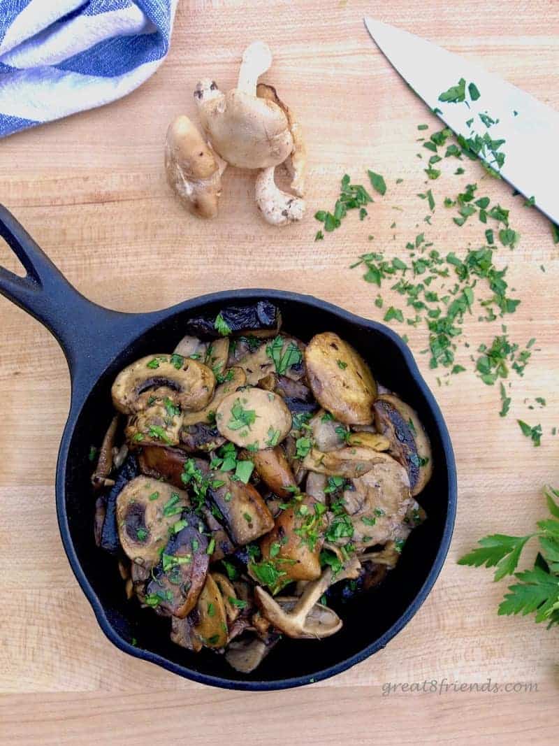  Mushrooms in Garlic Sauce in cast iron skillet.