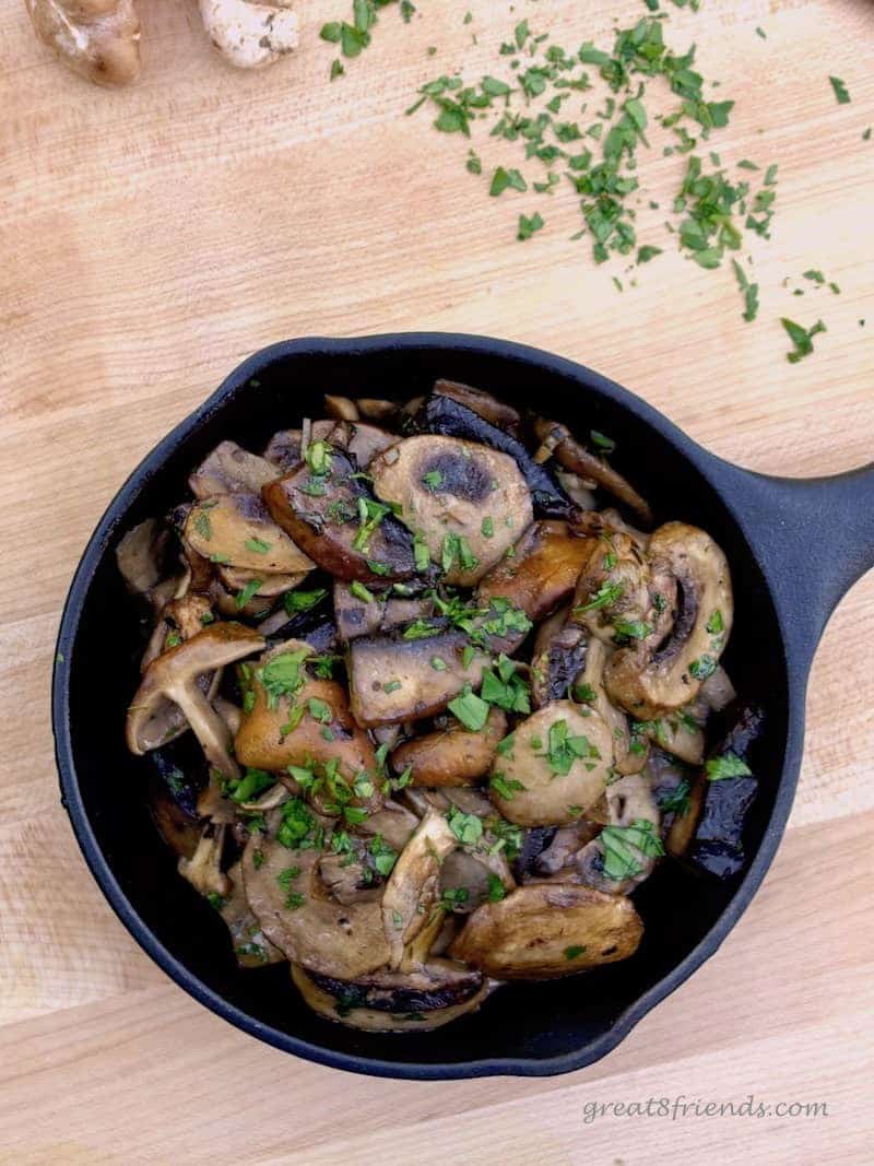 Overhead shot of  Mushrooms in Garlic Sauce in cast iron skillet