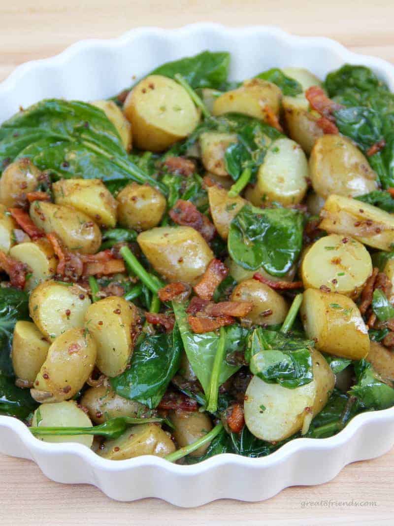 Up close view of Warm Spinach Potato Salad with Bacon Vinaigrette.