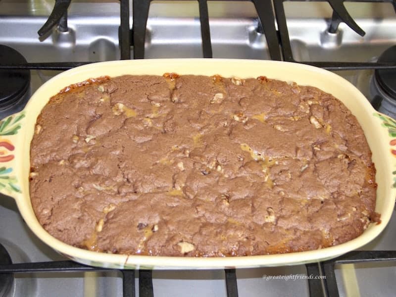 Caramel Chocolate Chip cookies in a yellow oblong ceramic baking pan.