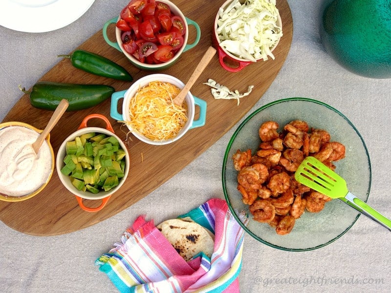 Overhead shot  of shrimp and toppings for Tacos.