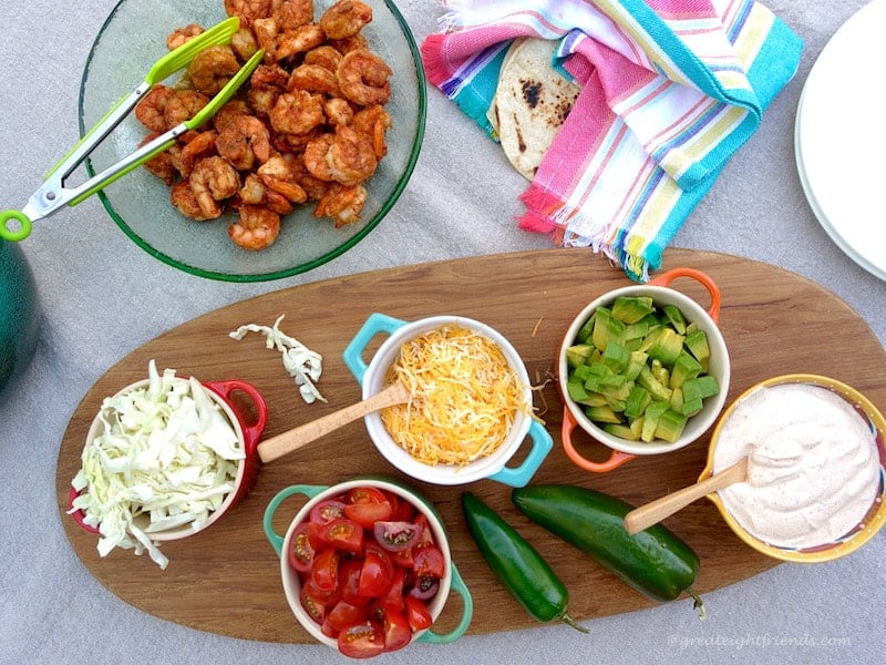 Overhead shot  of shrimp and toppings for Cajun Shrimp Tacos.