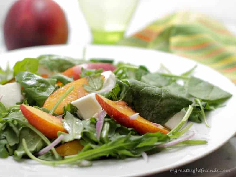 Close up of Marinated Nectarine Salad on a white plate.