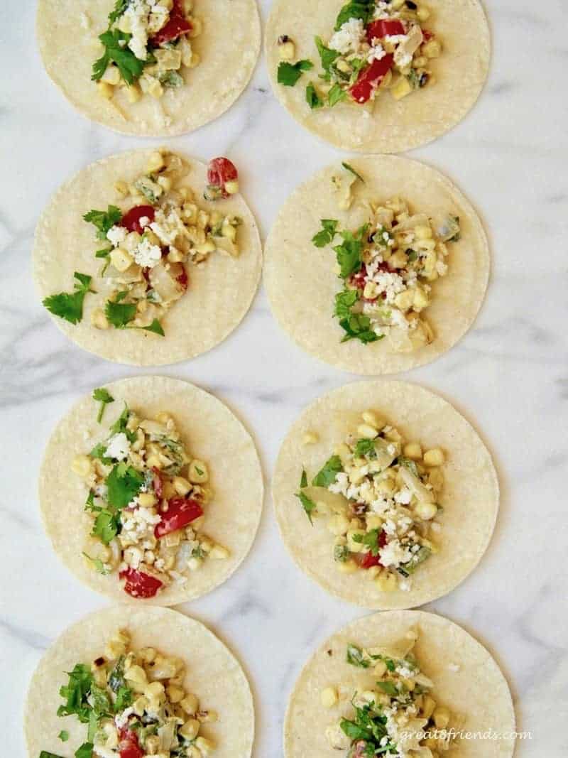 Charred Poblano Tacos - "street tacos" made with delicious Poblano peppers, sweet corn and onion. Try this as an appetizer or main course!