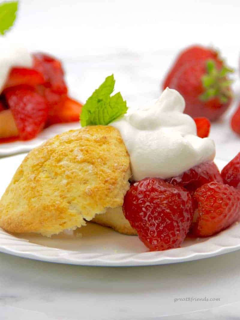 Strawberry Shortcake biscuits served with ruby red strawberries and whipped cream.
