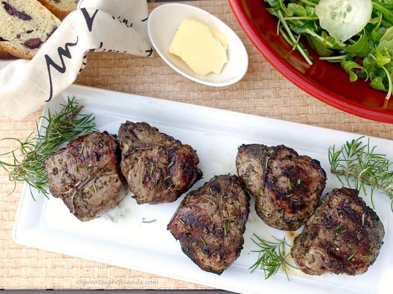 Grilled Lamb Chops on a rectangular platter.