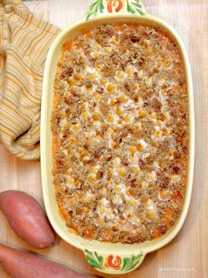 This Sweet Potato Casserole is out of this world delicious and even those that don't normally serve themselves sweet potatoes will love it!