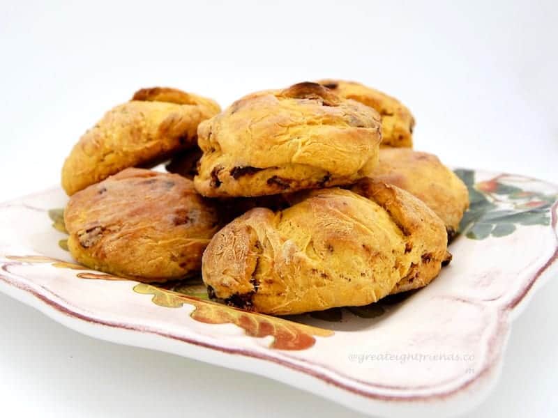 Pumpkin Biscuits stacked on a plate.