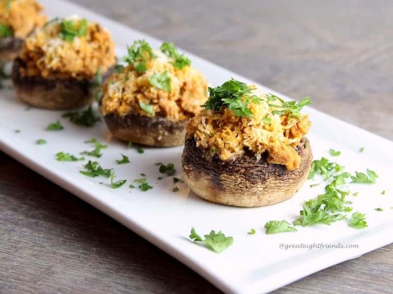 Sausage Stuffed Mushrooms on a plate. -
