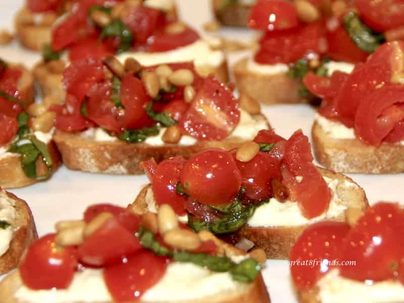 Close up photo of several tomato crostini.