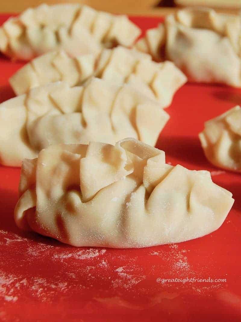 Pork Dumplings with Sesame Dipping Sauce