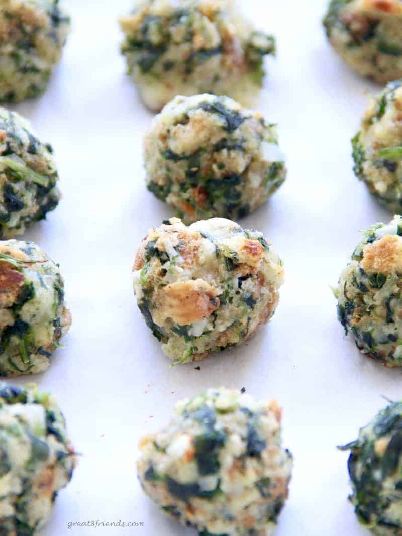 Super Simple Spinach Balls, the name says it all. Make these, freeze them, then you have the perfect appetizer ready to pop in the oven for any occasion.