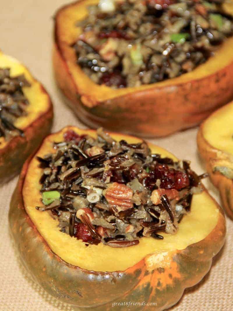 Acorn squash cut in half and stuffed with wild rice.