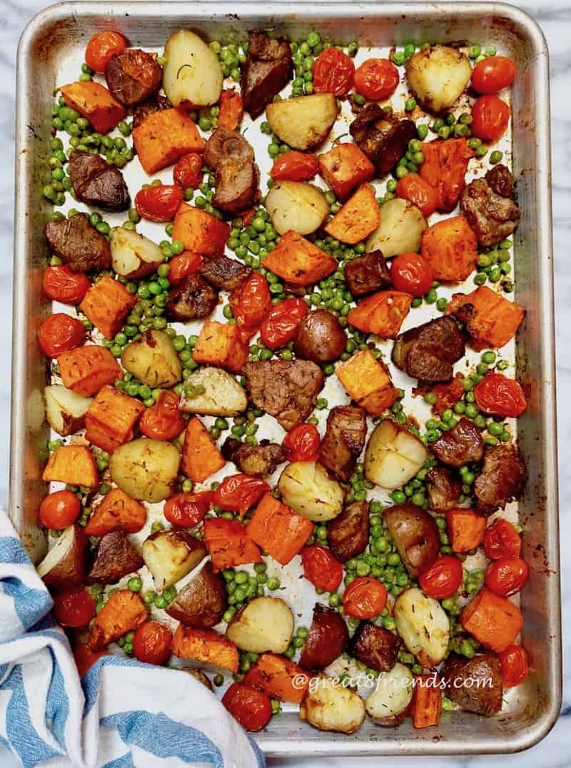 Overhead shot of sheet pan lamb dinner on the sheet pan.