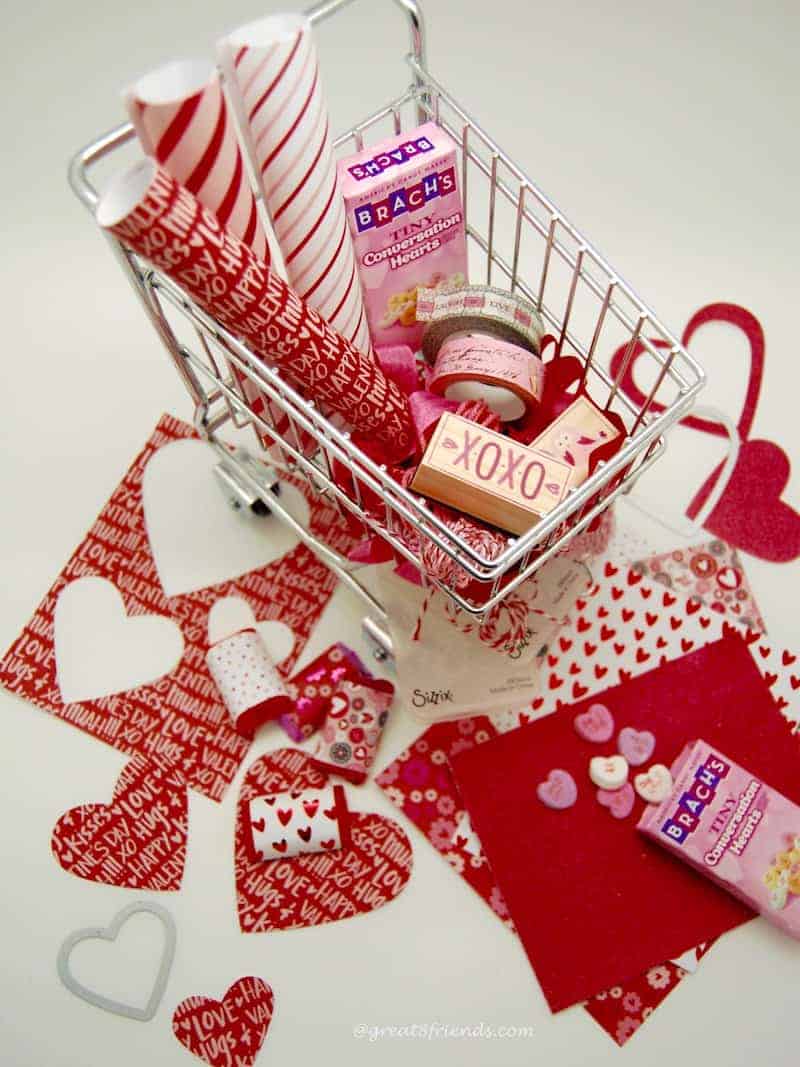 Valentine's Wrapped with Love craft supplies in a mini shopping cart.