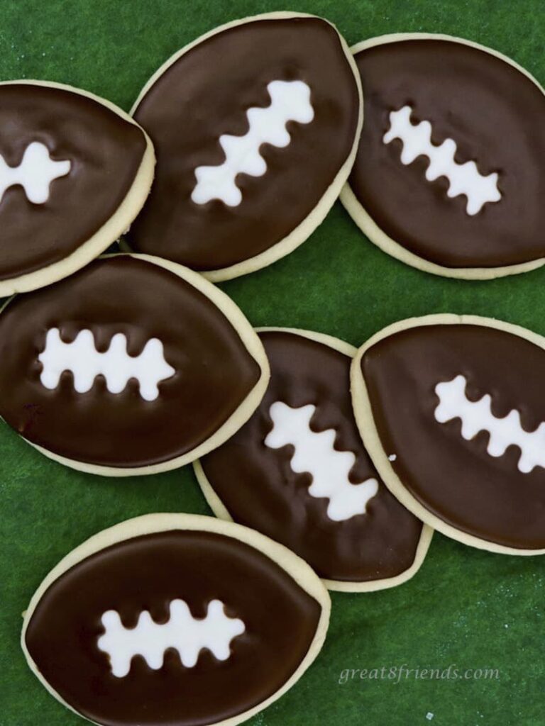 Football Cookies on green felt.