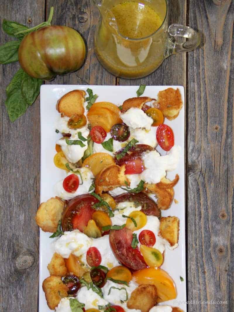 Change up your everyday green salad with this heavenly Tomato Burrata Salad with a flavorful vinaigrette and simple homemade croutons!