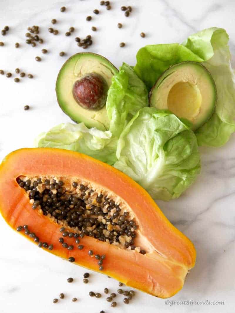 This Papaya and Avocado salad is fresh and simple to make! The dressing includes the papaya seeds which adds a delicious peppery mustard flavor.