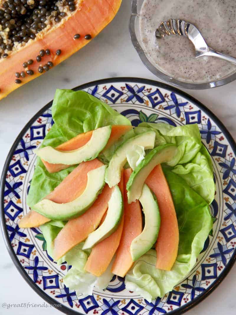 This Papaya and Avocado salad is fresh and simple to make! The dressing includes the papaya seeds which adds a delicious peppery mustard flavor.