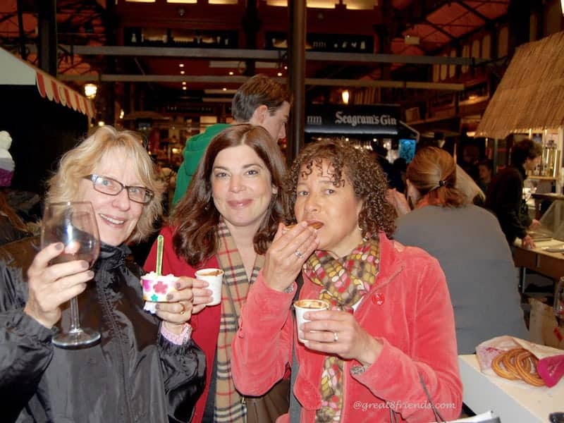 3 women eating snacks.