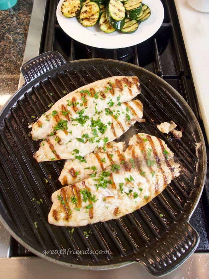 Overhead shot of two pieces of fish on a grill for fish Friday.