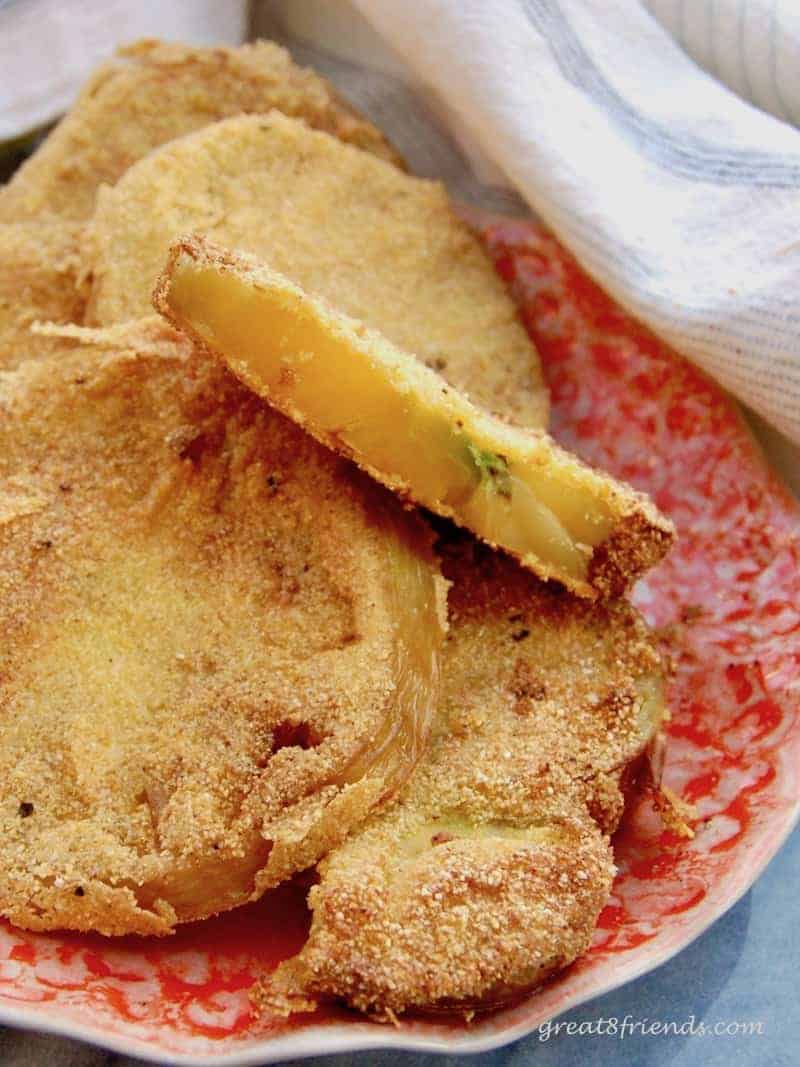 Slice fried Green Tomatoes on a plate.