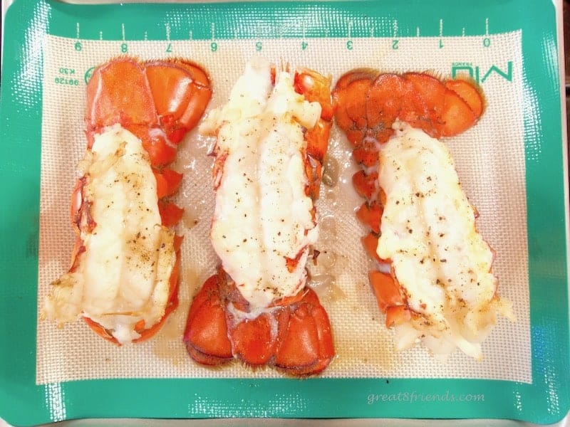 Lobster Tails on a silpat sheet ready to broil.