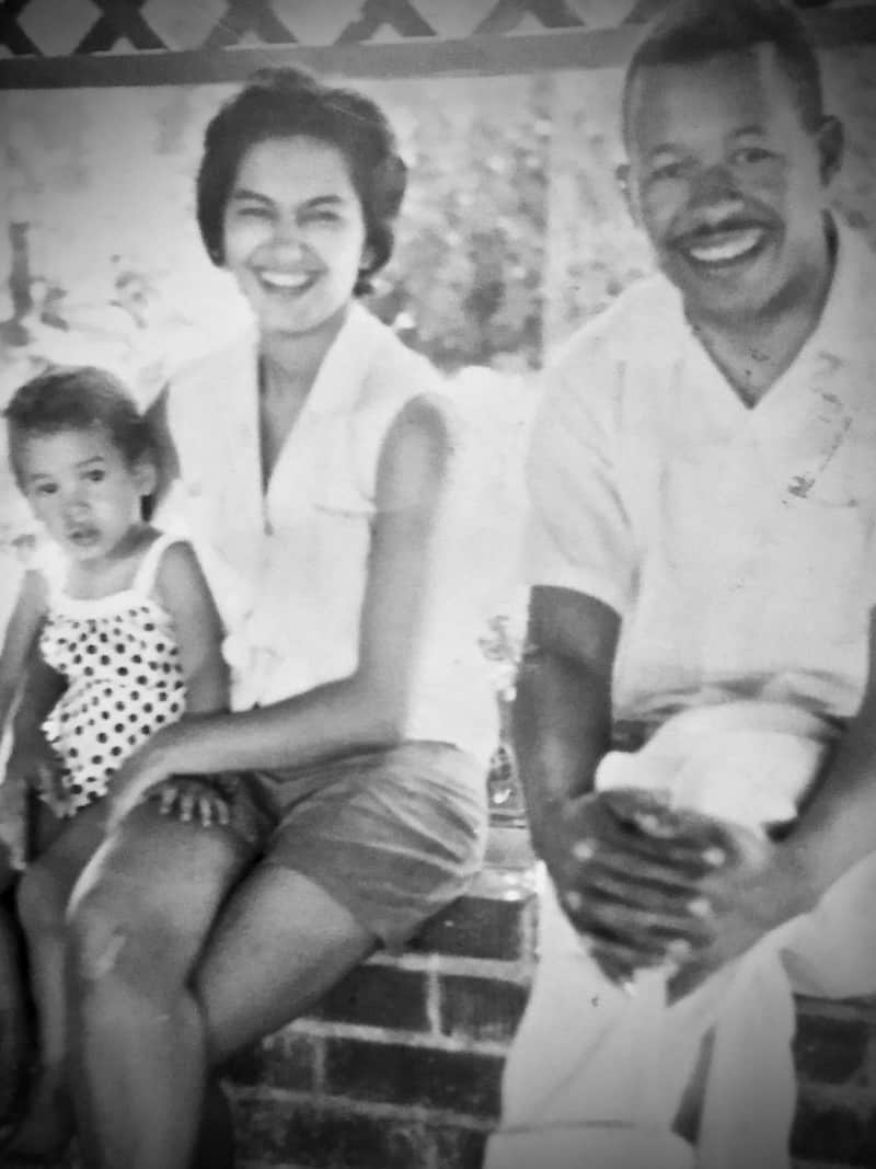 Black and white photo of an African American family of three.