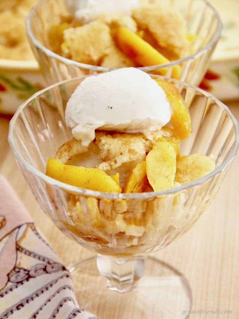 Fresh fruit dessert with homemade vanilla ice cream in a glass dish.