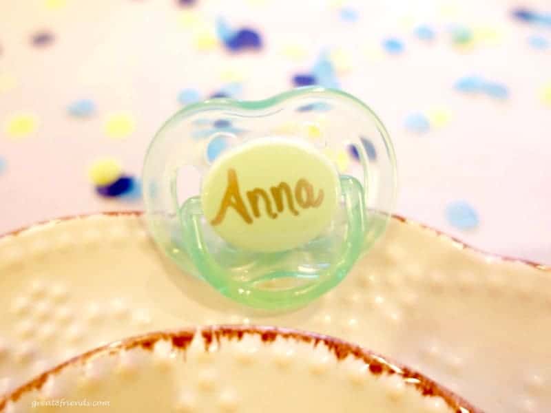 Unclose baby pacifier with the name Anna written on the base.