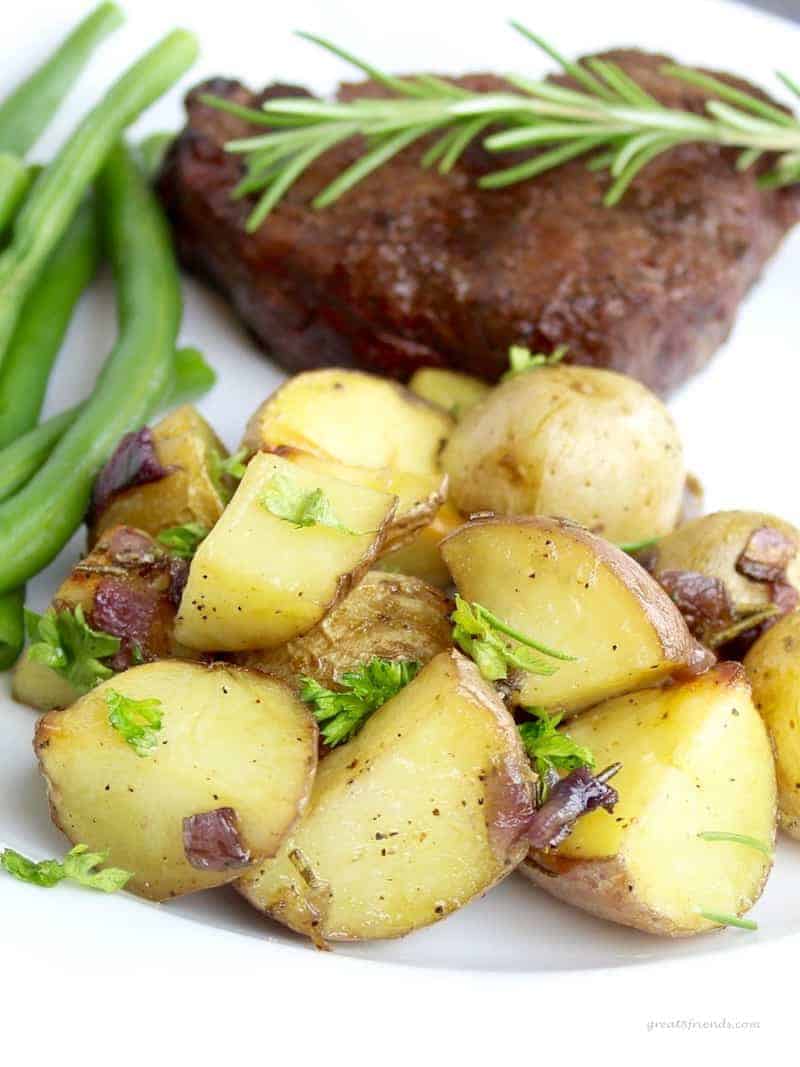 Roasted Herbed Baby Potatoes with steak and green beans.