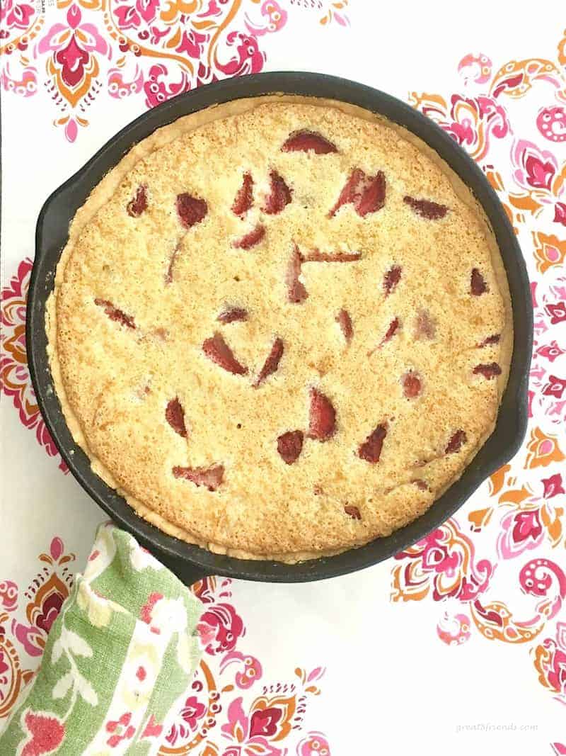 Overhead shot of Buttery Crusted Strawberry Rhubarb Tart in a cast iron skillet.